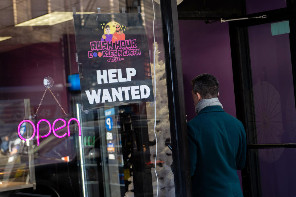 NEW YORK, NEW YORK - JANUARY 12: A person walks into a new cookie shop next to a 