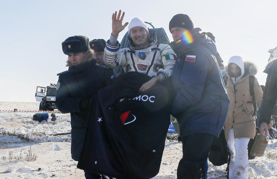 Rescue team members carry Italian astronaut Luca Parmitano shortly after the landing of the Russian Soyuz MS-13 space capsule about 150 km ( 80 miles) south-east of the Kazakh town of Zhezkazgan, Kazakhstan, Thursday, Feb. 6, 2020. A Soyuz space capsule with U.S. astronaut Christina Koch, Italian astronaut Luca Parmitano and Russian cosmonaut Alexander Skvortsov, returning from a mission to the International Space Station landed safely on Thursday on the steppes of Kazakhstan. (Sergei Ilnitsky/Pool Photo via AP)