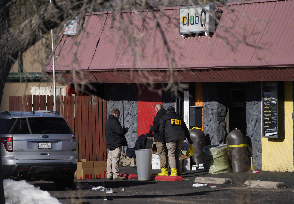 Law enforcement investigators exit Club Q, the site of a weekend mass shooting, on Tuesday, Nov. 22, 2022, in Colorado Springs, Colo. Anderson Lee Aldrich opened fire at Club Q, in which five people were killed and others suffered gunshot wounds before patrons tackled and beat the suspect into submission. (AP Photo/David Zalubowski)