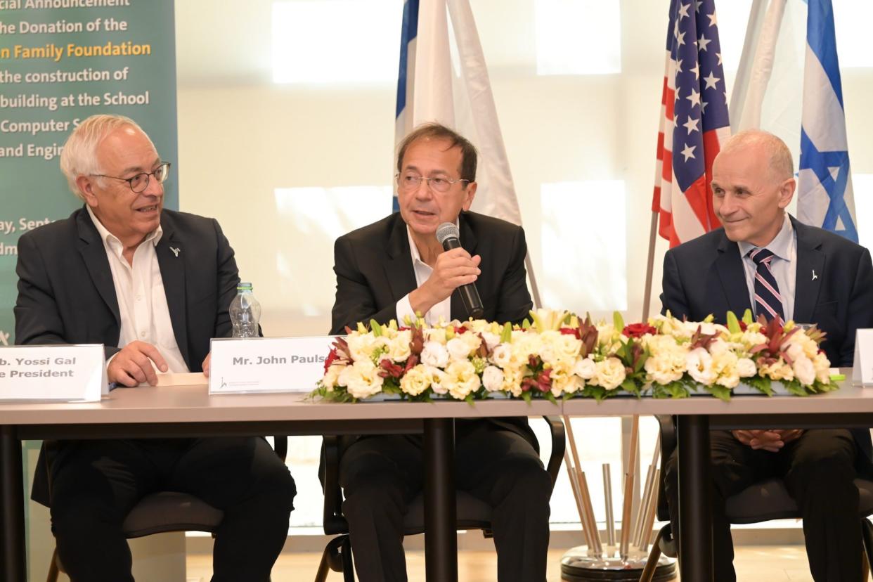 Philanthropist John Paulson, center, at the announcement of his $27 million gift to The Hebrew University of Jerusalem, is flanked by university vice-president Yossi Gal, left, and president Asher Cohen.