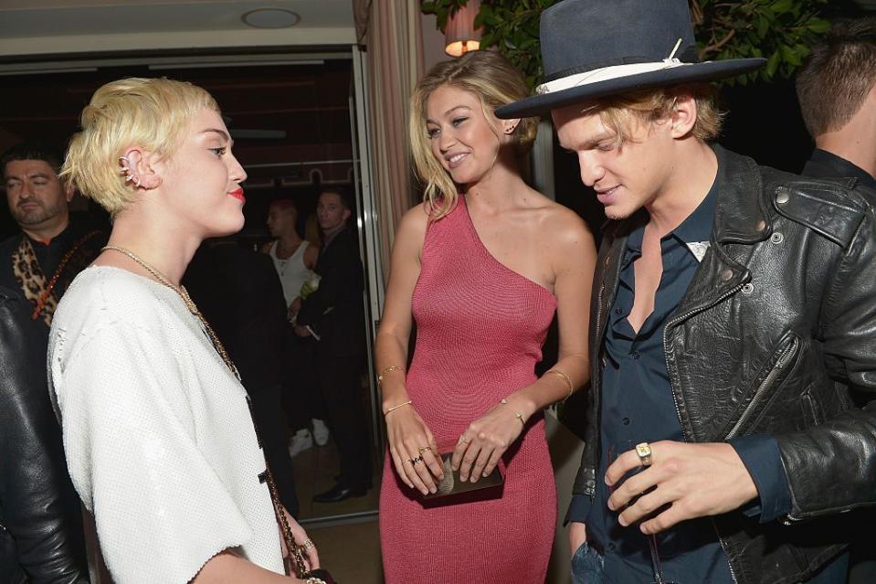 west hollywood, ca january 22 recording artist miley cyrus, honoree gigi hadid l and singer cody simpson attend the daily front row fashion los angeles awards show at sunset tower on january 22, 2015 in west hollywood, california photo by charley gallaygetty images for the daily front row