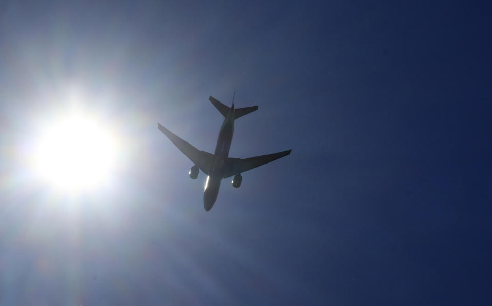 LYNDHURST, NJ - SEPTEMBER 16: A Delta Air Lines airplane passes the sun on approach to Newark Liberty Airport on September 16, 2018 as seen from Lyndhurst, New Jersey. (Photo by Gary Hershorn/Getty Images)