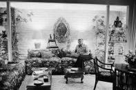 <p>Kirk Douglas lounges in the living room of his Beverly Hills home in 1976.</p>