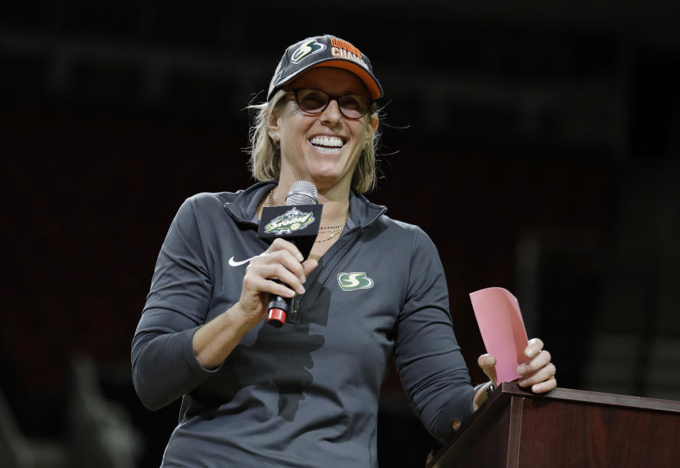 FILE - Seattle Storm owner Ginny Gilder speaks during a fan rally to celebrate the Storm winning the 2018 WNBA basketball championship, Sunday, Sept. 16, 2018, in Seattle. As Title IX marks its 50th anniversary this year, Gilder is one of countless women who benefited from the enactment and execution of the law, translating those opportunities into becoming leaders in their professional careers. (AP Photo/Ted S. Warren, File)