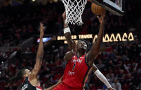 New Orleans Pelicans forward Zion Williamson (1) shoots over Portland Trail Blazers forward Jabari Walker during the second half of an NBA basketball game in Portland, Ore., Tuesday, April 9, 2024. (AP Photo/Craig Mitchelldyer)