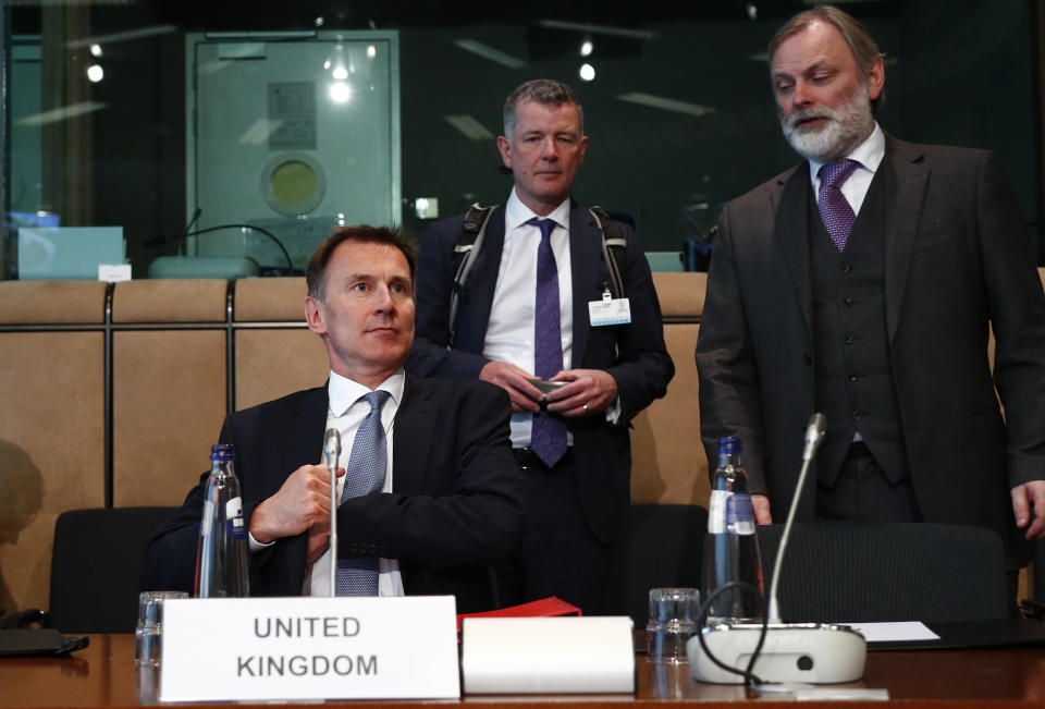 British Foreign Secretary Jeremy Hunt, left, waits for the start of a meeting at the European Council in Brussels, Monday, May 13, 2019. (Francois Lenoir, Pool Photo via AP)