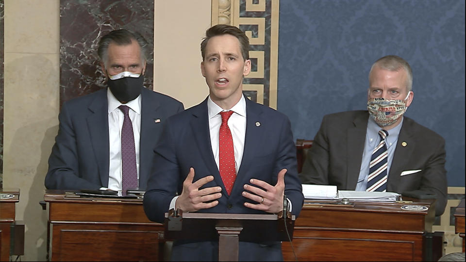 In this image from video, Sen. Josh Hawley, R-Mo., speaks as the Senate reconvenes to debate the objection to confirm the Electoral College Vote from Arizona, after protesters stormed into the U.S. Capitol on Wednesday, Jan. 6, 2021. (Senate Television via AP)
