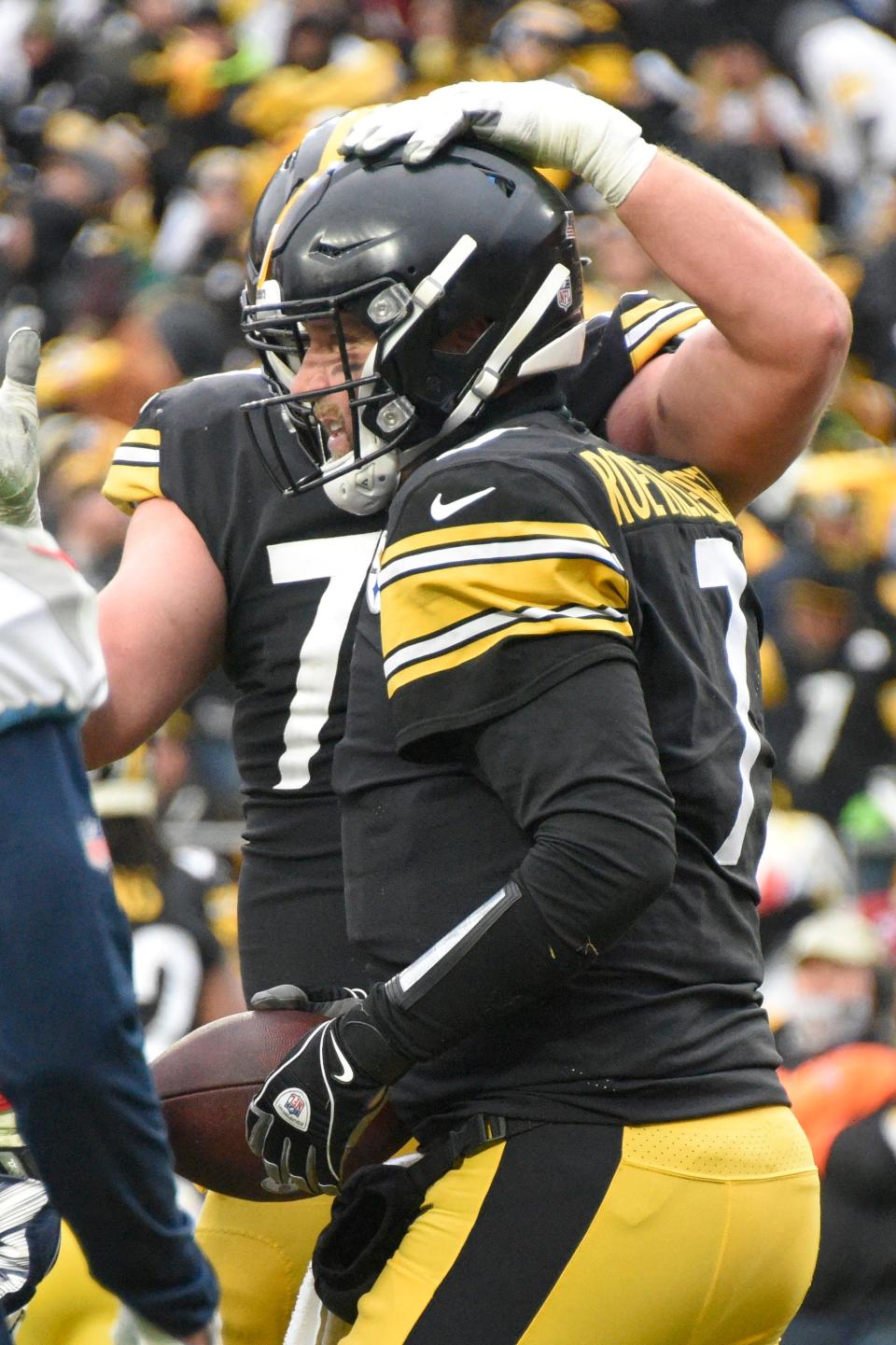 Pittsburgh Steelers quarterback Ben Roethlisberger (7) celebrates with offensive tackle Joe Haeg (71) after scoring a touchdown against the Tennessee Titans during the second half of an NFL football game, Sunday, Dec. 19, 2021, in Pittsburgh. (AP Photo/Don Wright)