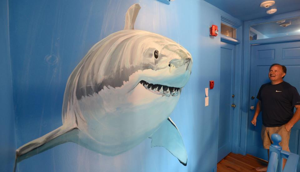 A great white shark frames the stairway leading to bedrooms in the new Tommy's Place Centerville. The nonprofit offers free one-week vacations in Centerville or Falmouth for families with children who are struggling with cancer.