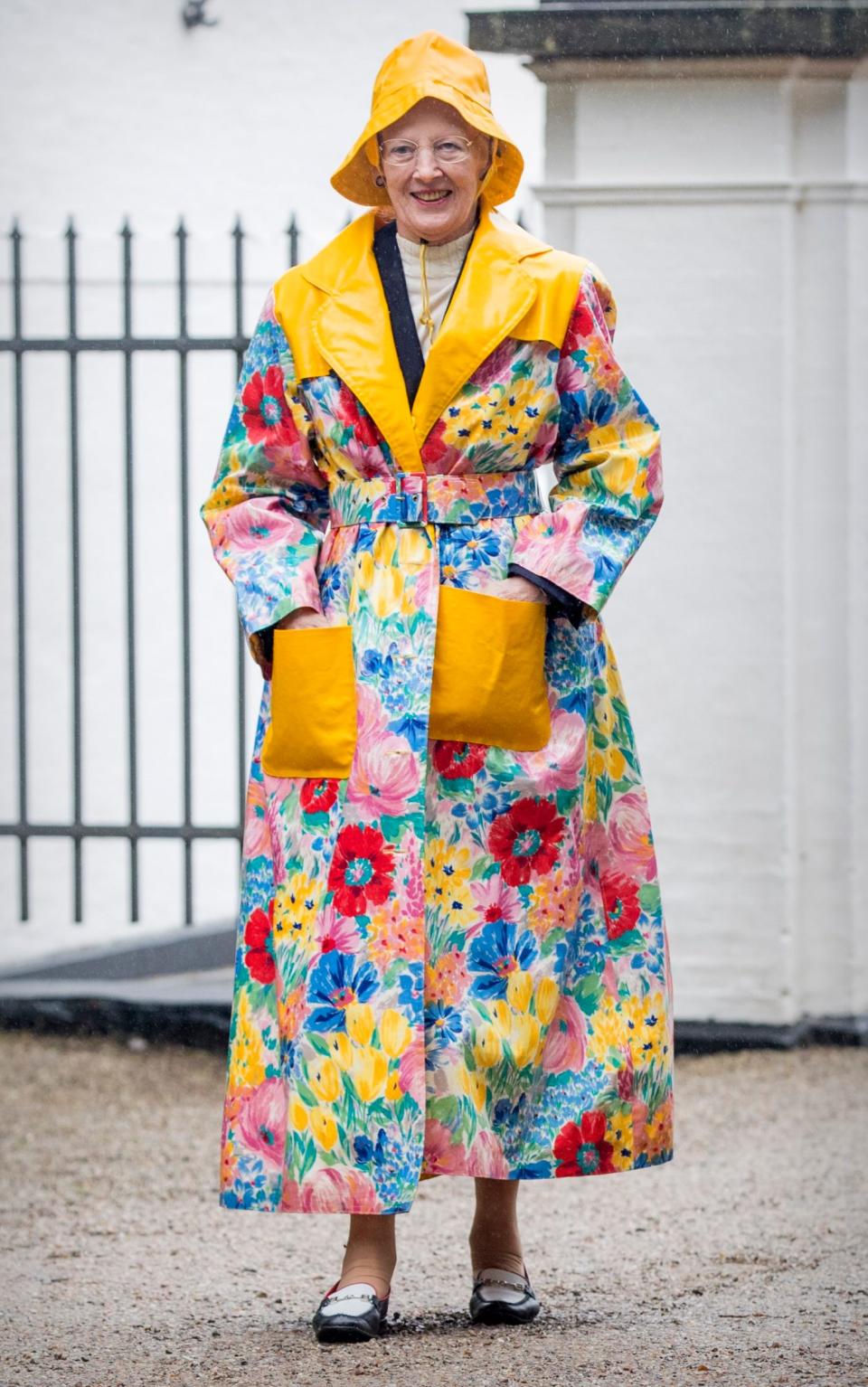 Queen Margrethe in raincoat and hat