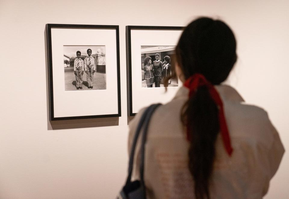 Heaven Montero, Detroit, admires photographs in the James Barnor exhibition at the Detroit Institute of Arts. “There’s so much life, even in black and white,” Montero said.