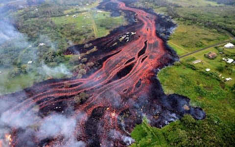 Lava flowing into the ocean set off a chemical reaction which created a toxic plume known as laze - Credit: Anadolu Agency