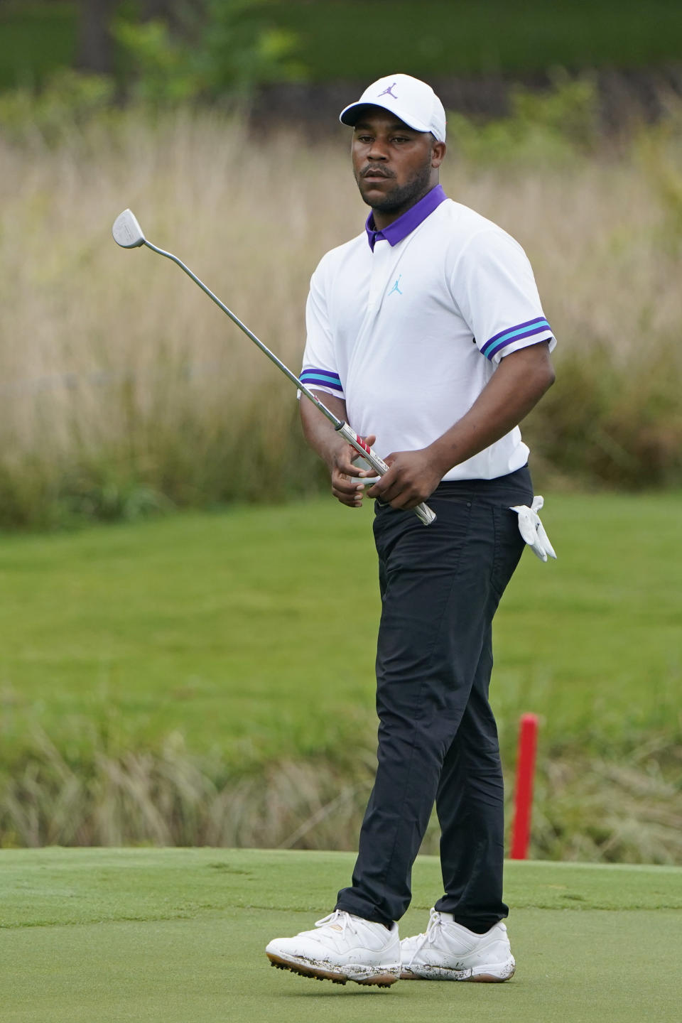 Harold Varner III misses his birdie putt attempt on the seventh hole during the first round of the Wyndham Championship golf tournament at Sedgefield Country Club on Thursday, Aug. 13, 2020, in Greensboro, N.C. (AP Photo/Chris Carlson)