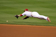 ST LOUIS, MO - OCTOBER 27: Nick Punto #8 of the St. Louis Cardinals dives for a hit by Michael Young #10 of the Texas Rangers in the third inning during Game Six of the MLB World Series at Busch Stadium on October 27, 2011 in St Louis, Missouri. (Photo by Doug Pensinger/Getty Images)