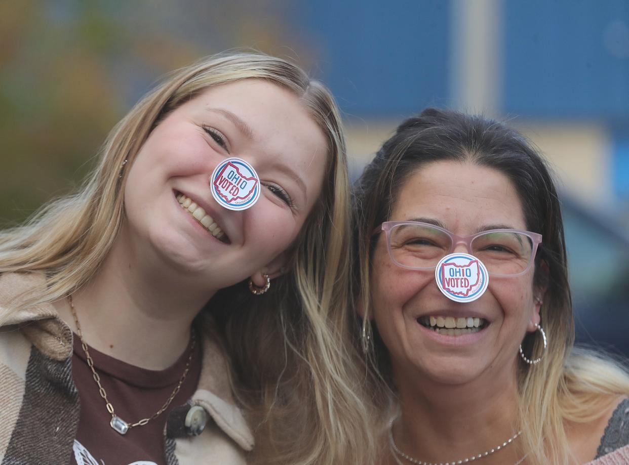 Olivia Chew and her mother Stephanie Chew outside the Community Vineyard Church polling place on Tuesday, Nov. 7, 2023, in Cuyahoga Falls, Ohio. [Phil Masturzo/ Beacon Journal]