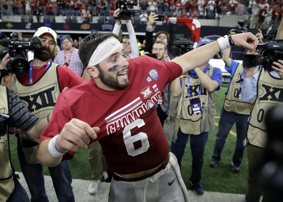 Oklahoma quarterback Baker Mayfield celebrates after their Big 12 Conference championship against TCU on Saturday, Dec. 2, 2017, in Arlington, Texas. (AP Photo/Tony Gutierrez)