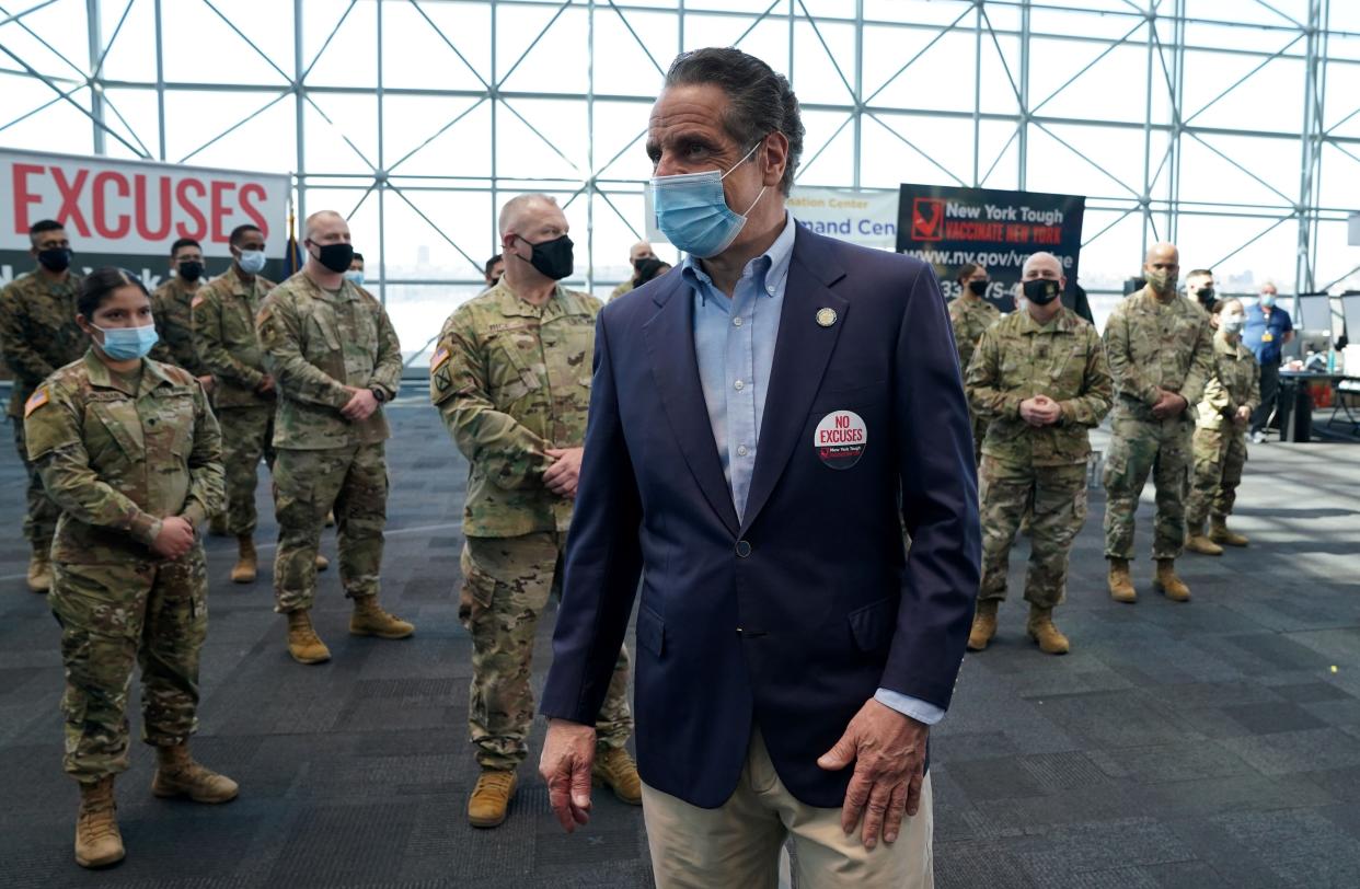 Gov. Andrew Cuomo talks with members of the National Guard during an event at the Jacob K. Javits Convention Center as he announces the start of the statewide "Vaccinate NY" ad campaign to encourage all New Yorkers to get vaccinated, on April 6, 2021 in New York City.
