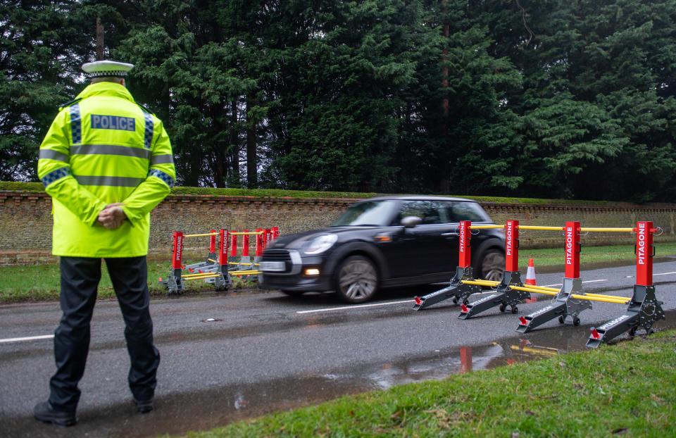 Police using anti-vehicle barriers at a security checkpoint ahead of Queen Elizabeth II attending a church service at St Mary Magdalene Church in Sandringham, Norfolk. (Photo by Joe Giddens/PA Images via Getty Images)