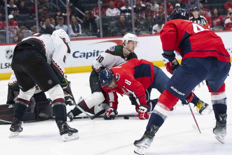 Washington Capitals left wing Alex Ovechkin (8) falls near the net during the first period of an NHL hockey game against the Arizona Coyotes, Sunday, March 3, 2024, in Washington. (AP Photo/Manuel Balce Ceneta)