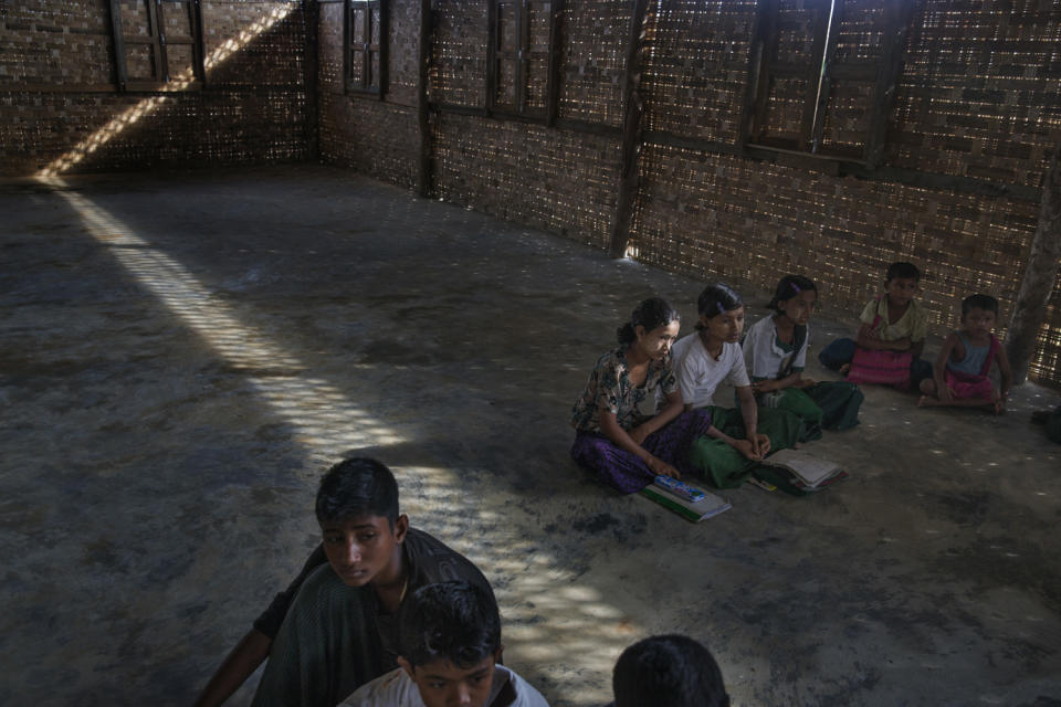 Children learning the Quran at a madrassa in one of the camps.