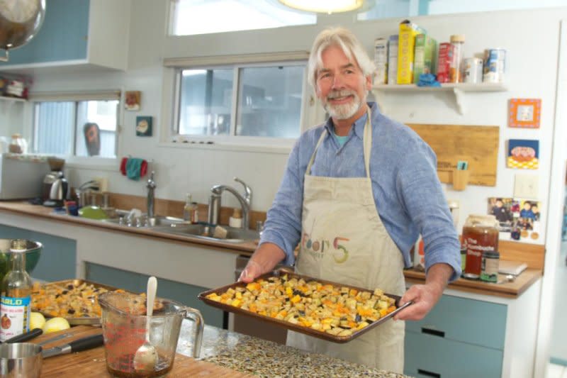 Stanford Medicine's Christopher Gardner, a professor of medicine, prepares a pan of eggplant squash and tempeh as part of the study's vegan offerings.. Photo by Louie Psyhoyos