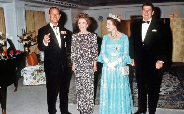 Queen Elizabeth II and Prince Phillip on Britannia with US President Ronald Reagan and his wife Nancy Reagan in 1983 - Getty Images