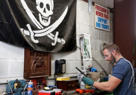 Rodger Brown finishes work on a front sight post assembly for an AR-15 style rifle barrel at Spike's Tactical LLC, a gunmaker in Apopka, Florida, U.S. December 10, 2018. Picture taken December 10, 2018. REUTERS/Gregg Newton