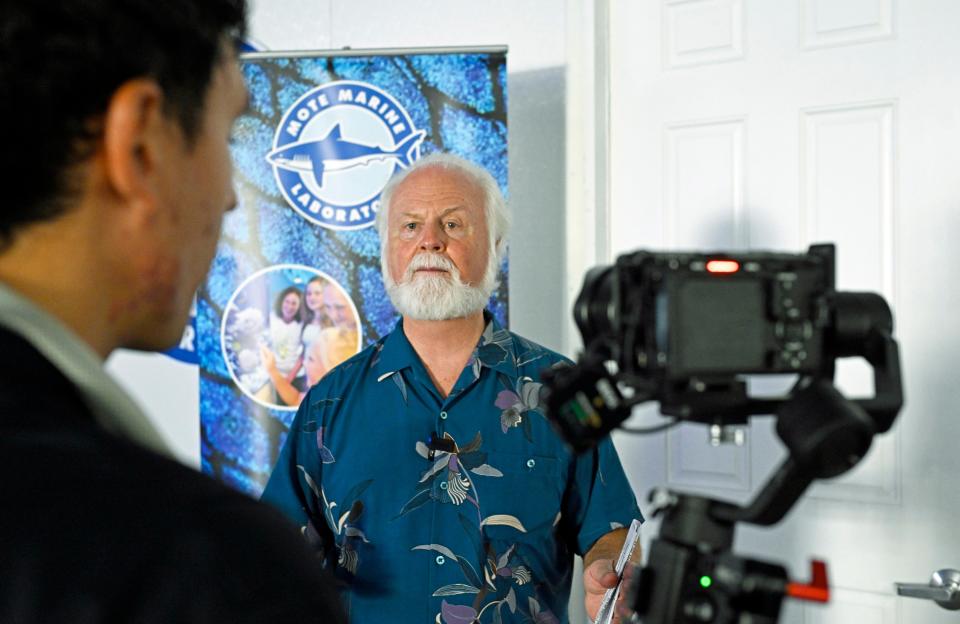 Michael Crosby, president & CEO of Mote Marine Laboratory & Aquarium, conducts a media interview Monday following the opening of Mote’s Florida Coral Reef Restoration Crab Hatchery Research Center.