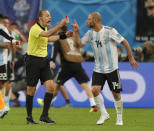 <p>Javier Mascherano argues with referee Cuneyt Cakir </p>
