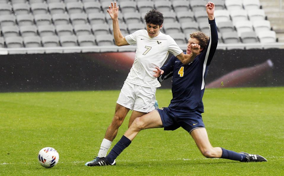 New Albany's Gabe Anthony and Cleveland St. Ignatius' Owen Maruca battle during the Division I state final Nov. 12 at Lower.com Field. The Eagles lost 2-0.