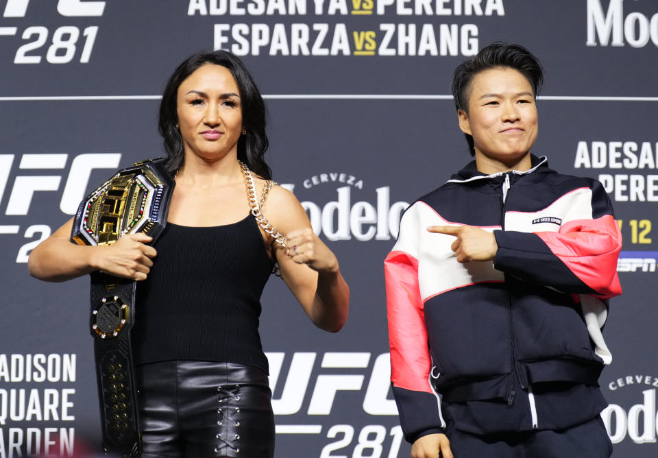 NEW YORK, NEW YORK - NOVEMBER 09: (L-R) Opponents Carla Esparza and Zhang Weili of China pose on stage during the UFC 281 press conference at Madison Square Garden on November 09, 2022 in New York City. (Photo by Chris Unger/Zuffa LLC)