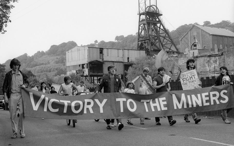 Young socialists marching with banners in 1984 to support miners