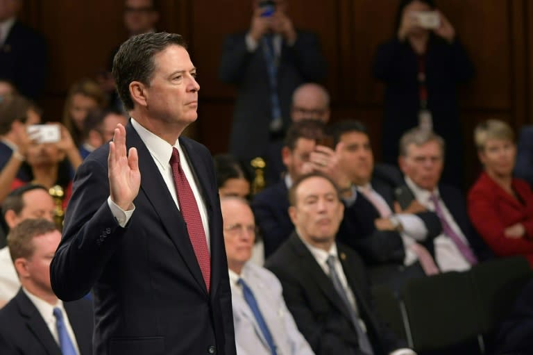 Former FBI Director James Comey takes the oath before he testifies during a US Senate Select Committee on Intelligence hearing in Washington, DC June 8, 2017