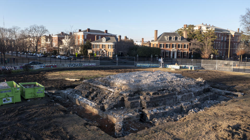 A pile of rubble is all that is left after the removal of the pedestal that once held the statue of Confederate General Robert E. Lee on Monument Ave., Thursday Dec. 23, 2021, in Richmond, Va. Workers will continue their search for a famed 1887 time capsule that was said to be buried under the massive monument. A box found in the pedestal did not contain items described in historic papers. (AP Photo/Steve Helber)