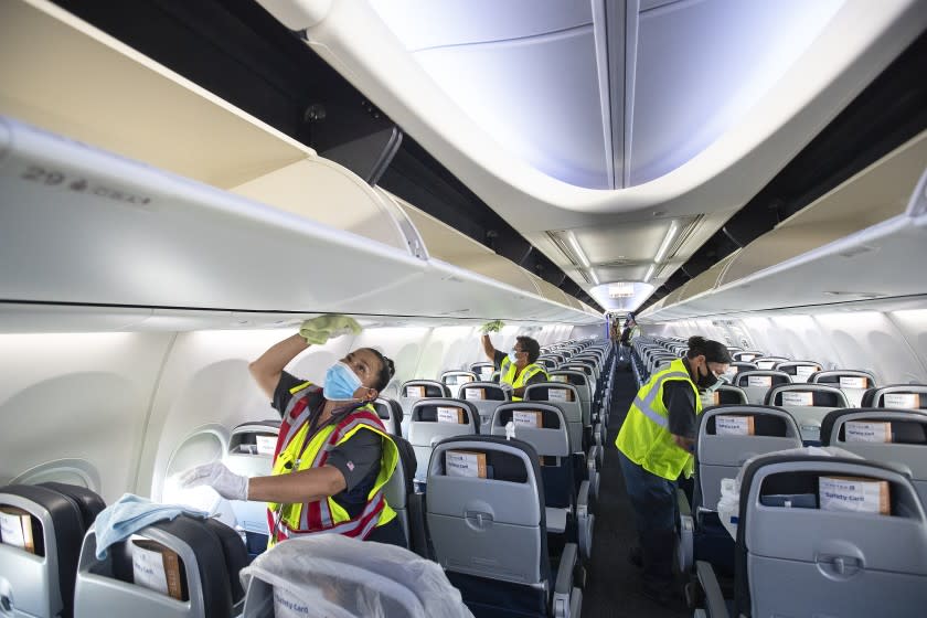 LOS ANGELES, CA -JULY 09, 2020:The cabin area of a United Airlines 737 jet is disinfected before passengers are allowed to board at LAX on Thursday, July 9, 2020 in Los Angeles, CA. (Mel Melcon / Los Angeles Times)