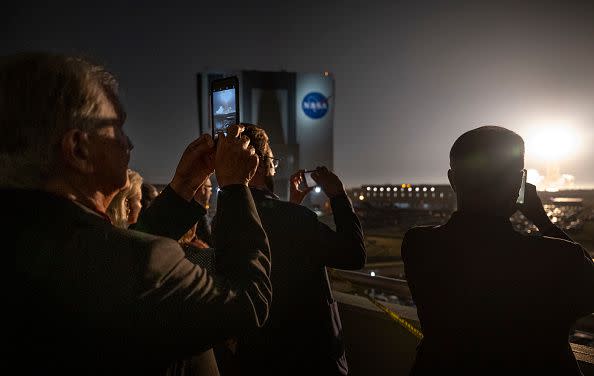 KENNEDY SPACE CENTER, FL - NOVEMBER 16:  In this handout provided by the U.S. National Aeronautics and Space Administration (NASA), guests watch the launch of NASAs Space Launch System rocket carrying the Orion spacecraft on the Artemis I flight test, from Launch Complex 39B on November 16, 2022, at the Kennedy Space Center, Florida. NASAs Artemis I mission is the first integrated flight test of the agencys deep space exploration systems: the Orion spacecraft, Space Launch System (SLS) rocket, and ground systems. SLS and Orion launched at 1:47am ET from Launch Pad 39B at the Kennedy Space Center. (Photo by Bill Ingalls/NASA via Getty Images)