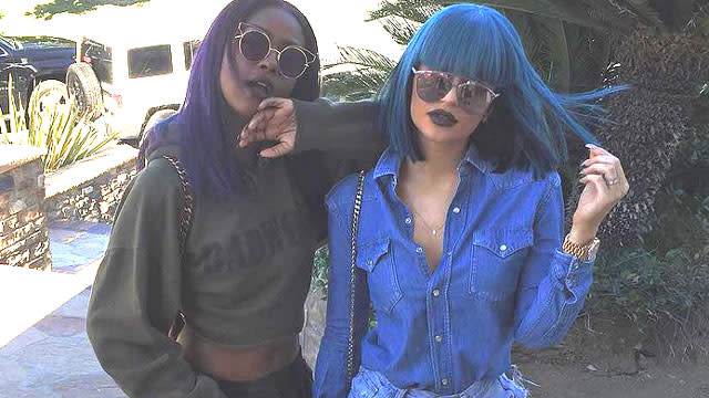 Kylie Jenner is doing her own thing, and she doesn't care what people think -- not even her half-sister Kourtney Kardashian. On Friday night, Kylie rocked a blue wig with short bangs while hanging out with her boyfriend Tyga and Kourtney's ex, Scott Disick, at the West Hollywood nightclub 1 OAK. Splash News The 18-year-old reality star was photographed with Tyga and Scott outside the club, wearing dark, round shades and trying to stay out of the paparazzi pics. <strong>WATCH: Tyga Shares Super Sexy Photo of Kylie Jenner on Her 18th Birthday </strong> Kylie kept up the blue wig look on Saturday night as well when she hit the town with her friends, including model Chantell Jeffries. The blue theme was also evident in her wardrobe, as she sported a button-down denim top and some ripped denim short-shorts that showed a flash of her butt. Splash News The <em>Keeping Up With the Kardashians</em> star also shared a pic of her Louise Brooks-style wig on Instagram on Friday. It's hard to make short blue wigs actually work but Kylie manages to pull it off . WATCH: Kylie Jenner Models Tyga's Boxer Briefs on Snapchat There also doesn't seem to be any bad blood between Kylie and Kourtney after the youngest Jenner sister hung out with Scott. On Sunday night, the sisters posed with mom, Kris Jenner, at the 2015 MTV Video Music Awards. Getty Images One thing she hasn't been pulling off is responsible water conservation. Kylie and her boyfriend were reportedly cited for water over consumption at their home in draught-starved California. 