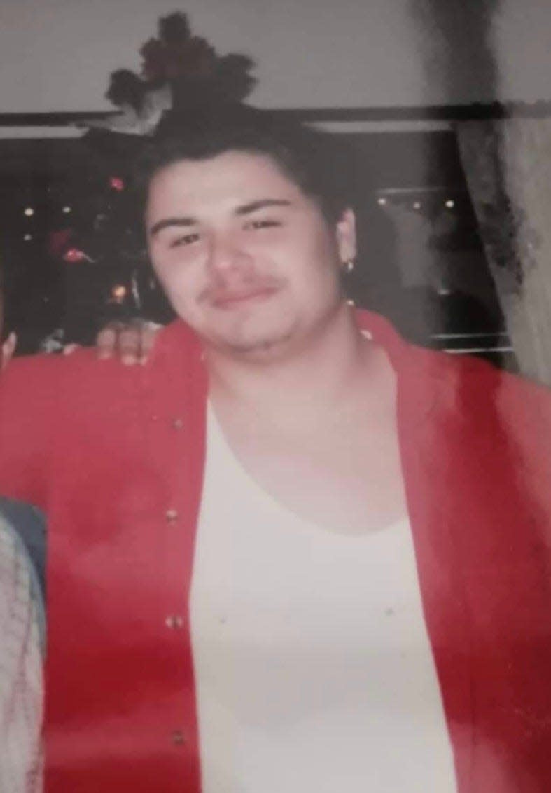 Efrain Hidalgo Jr. is pictured in a family photo at age 26 around Christmas before he was sentenced to 60 to 150 years in prison for crimes related to running a heroin drug ring. Hidalgo, now 48, argues his sentence was excessive.
