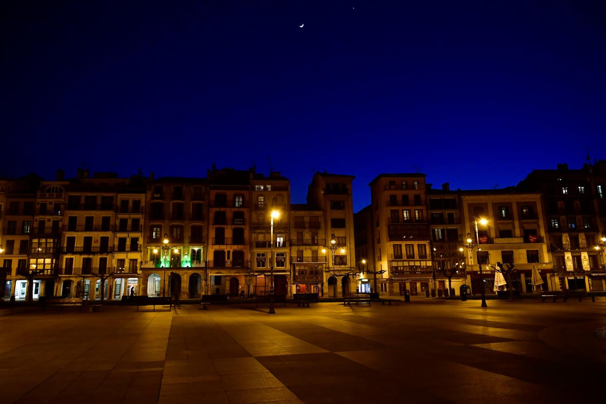 The streets are deserted along Plaza del Castillo square during lockdown against the spread of coronavirus COVID-19, in Pamplona, northern Spain, on Saturday, March 28, 2020.