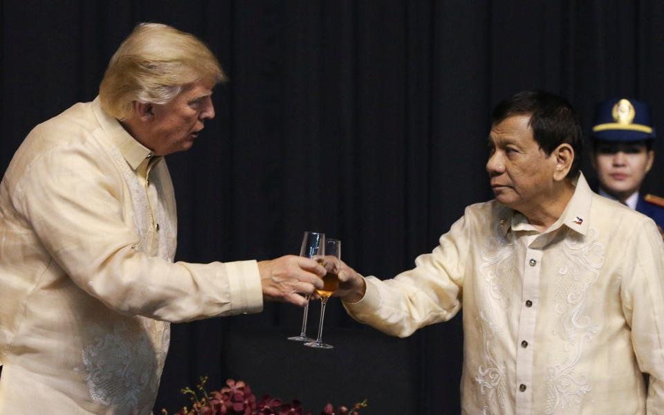 Donald Trump with Philippines President Rodrigo Duterte in Manila in November - Reuters pool