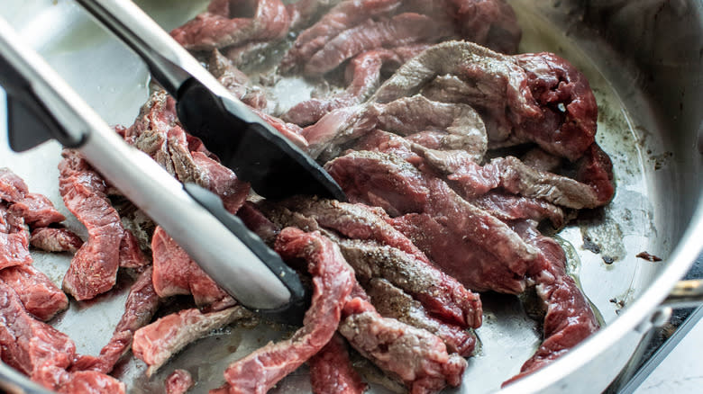 steak cooking in pan