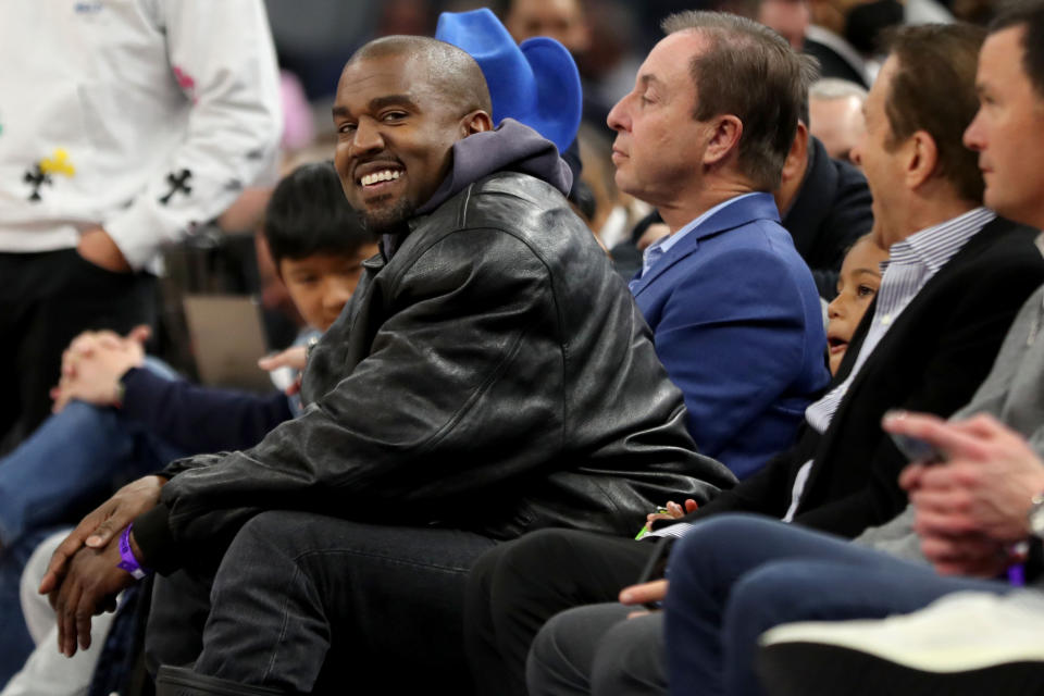 SAN FRANCISCO, CALIFORNIA -  MARCH 16: Kanye West, left, and his son, Saint West, got front row seats next to Golden State Warriors co-owners Joe Lacob and Peter Guber as they watch the game against the Boston Celtics in the second quarter at Chase Center in San Francisco, Calif., on Wednesday, March 16, 2022.  (Photo by Ray Chavez/MediaNews Group/The Mercury News via Getty Images)