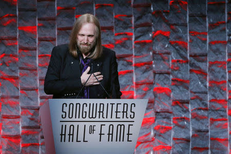 FILE PHOTO: Musician Tom Petty speaks to guests after being inducted during the 47th Songwriters Hall of Fame Induction ceremony in New York, U.S. on June 9, 2016. REUTERS/Eduardo Munoz/File Photo