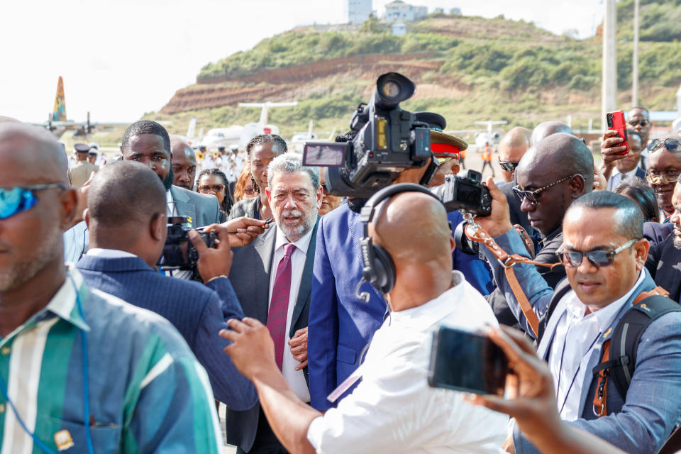 St. Vincent and the Grenadines Prime Minister Ralph Gonsalves is surrounded by the press as he receives leaders at the Argyle International Airport in Argyle, St. Vincent, Thursday, Dec. 14, 2023. St. Vincent is hosting a meeting between Venezuelan and Guyanan presidents over a long-standing dispute over the Essequibo territory, a vast border region rich in oil and minerals that represents much of Guyana's territory but that Venezuela claims as its own. (AP Photo/Lucanus D. Ollivierre)