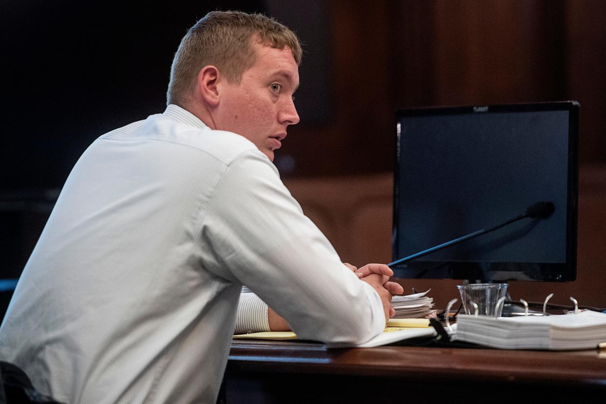 Ex-deputy Tyler McDonald listens in the courtroom during the first day of his assault trial May 8, 2023 in Asheville.