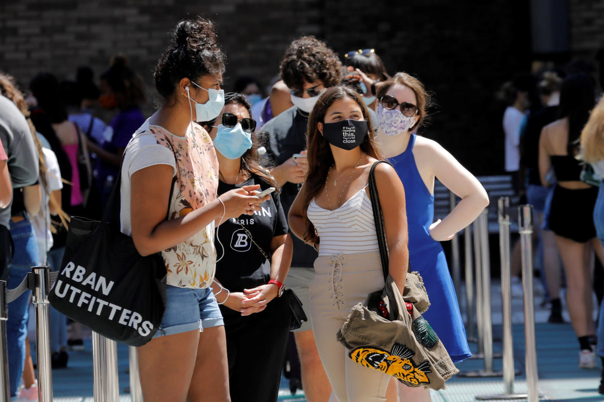 Students wear protective masks as they wait in line at a testing site for the coronavirus disease (COVID-19) set up for returning students, faculty and staff on the main New York University (NYU) campus in Manhattan, New York City, New York, U.S., August 18, 2020. REUTERS/Mike Segar