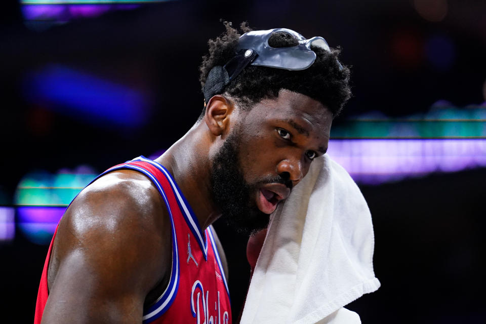 Philadelphia 76ers' Joel Embiid wipes his face during the first half of Game 4 of an NBA basketball second-round playoff series against the Miami Heat, Sunday, May 8, 2022, in Philadelphia. (AP Photo/Matt Slocum)