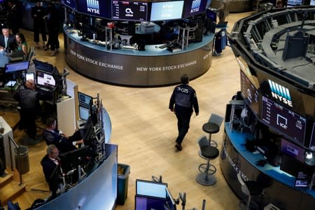 Traders work on the floor at the NYSE in New York