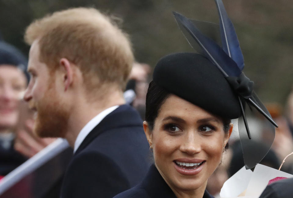 Britain's Prince Harry and Meghan, Duchess of Sussex meet members of the crowd after attending the Christmas day service at St Mary Magdalene Church in Sandringham in Norfolk, England, Tuesday, Dec. 25, 2018. (AP Photo/Frank Augstein)