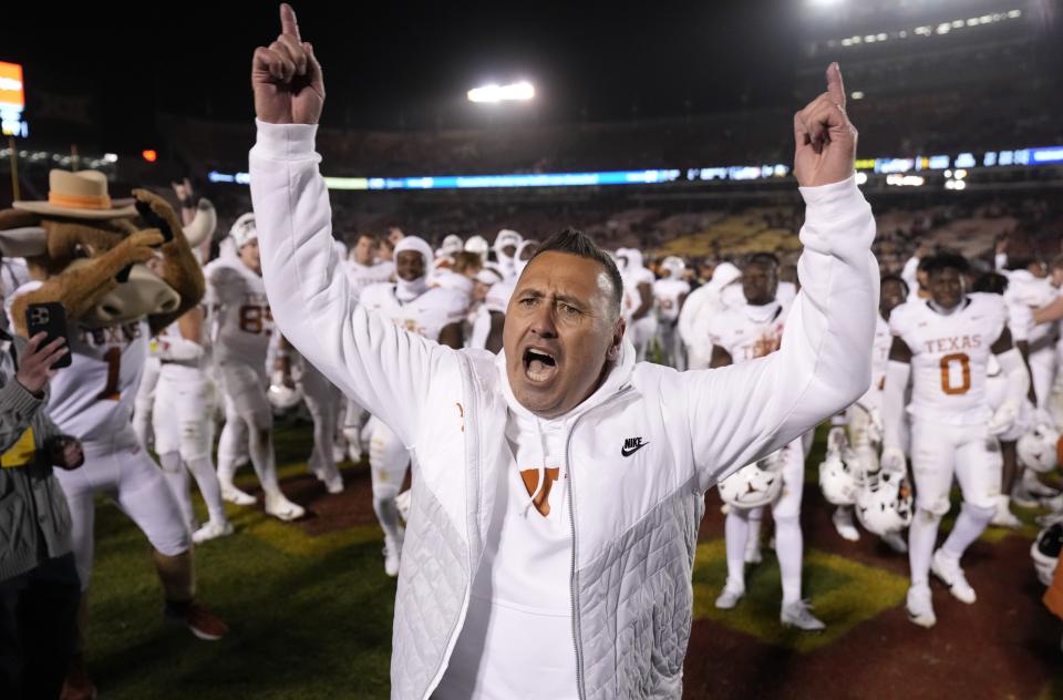 Texas coach Steve Sarkisian celebrates the team’s win over Iowa State in an NCAA college football game, Nov. 18, 2023, in Ames, Iowa. | Matthew Putney, Associated Press